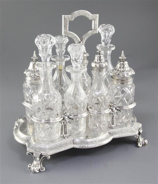 A Victorian silver eight bottle cruet stand and eight original bottles, by Walter & John Barnard, height 280mm, weight 40oz